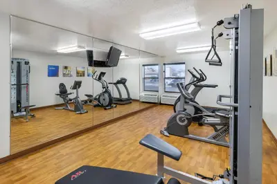 a gym with treadmills and elliptical machines at Comfort Inn & Suites Near Fallon Naval Air Station in Fallon