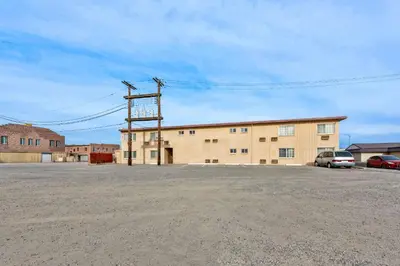 an empty parking lot in front of a building at Econo Lodge Fallon Naval Air Station Area in Fallon