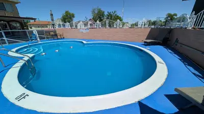 a large swimming pool with blue water in it at Econo Lodge Fallon Naval Air Station Area in Fallon