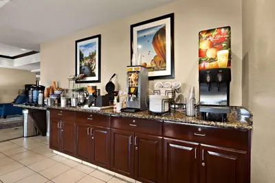 a counter in a hotel room with a coffee shop at Comfort Inn & Suites Airport Convention Center in Reno
