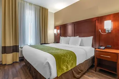 a hotel room with a large bed and a window at Comfort Suites Fernley in Fernley