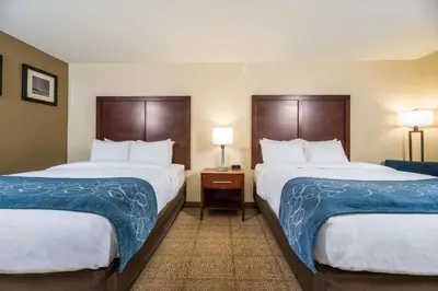 a hotel room with two beds and two lamps at Comfort Inn Tonopah in Tonopah