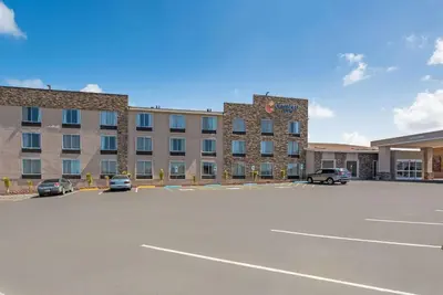 a large building with cars parked in a parking lot at Comfort Inn Tonopah in Tonopah