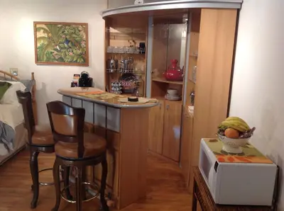a kitchen with a counter and a bar in a room at Winterfell Inn - No Xtra Fees, Dogs OK, King & Queen Suites in Arnold