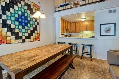 a dining room with a table and a kitchen at 2 Bed 2 Bath Apartment in Carnelian Bay in Carnelian Bay