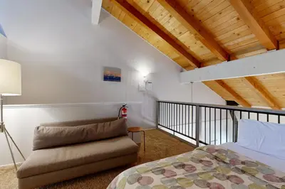 a bedroom with a bed and a couch at 2 Bed 2 Bath Apartment in Carnelian Bay in Carnelian Bay