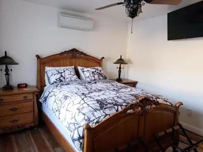 a bedroom with a bed and a ceiling fan at Yosemite Foothill Retreat - Private Guest Suite #2 in Coarsegold