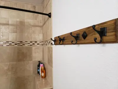 a bathroom with a shower with a bottle of soap at Yosemite Foothill Retreat - Private Guest Suite #2 in Coarsegold