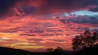 a sunset with clouds in the sky at Yosemite Foothill Retreat - Private Guest Suite #3 in Coarsegold
