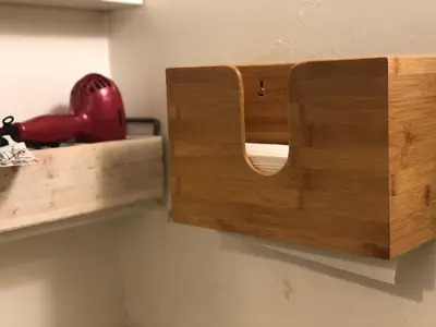 a wooden cabinet on a wall with a helmet on it at WHOLE Family - WholeVille in Sacramento