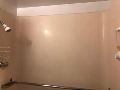 a shower stall in a bathroom with a wall at WHOLE Family - WholeVille in Sacramento