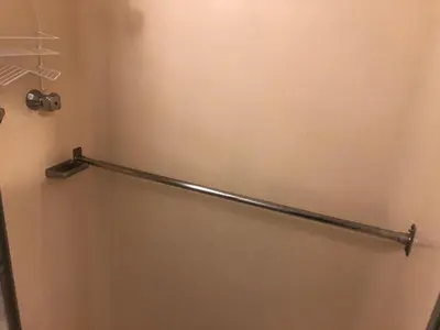 a towel rack on the wall of a bathroom at WHOLE Family - WholeVille in Sacramento