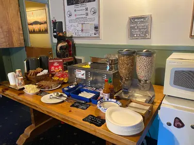 a table with a counter top with food and a blender at Cinnamon Bear Inn in Mammoth Lakes