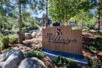 a sign for the village at minnetonka park at Village 3211 in Mammoth Lakes
