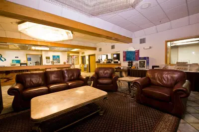 a waiting room with leather chairs and a table at Shilo Inn Mammoth Lakes in Mammoth Lakes