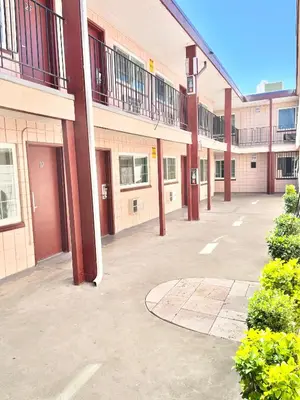 an empty parking lot outside of a building at Royal Lodge in Coalinga