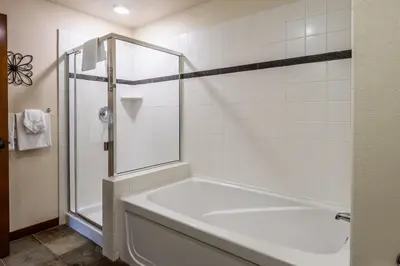 a white bathroom with a tub and a shower at Village # 3310 - Lincoln House in Mammoth Lakes