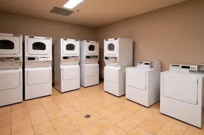 a laundry room with white appliances and washers and dryers at Village # 3310 - Lincoln House in Mammoth Lakes