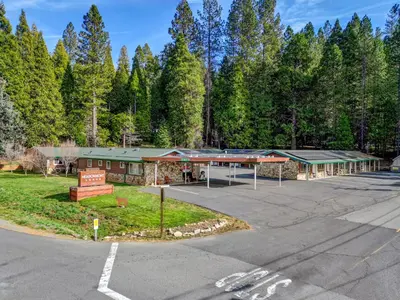 an empty parking lot in front of a building at Arnold Meadowmont Lodge in Arnold