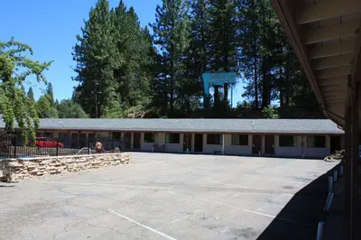 a large parking lot in front of a building at Mother Lode Motel in Placerville