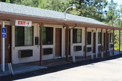 a building with an exit sign in front of it at Mother Lode Motel in Placerville