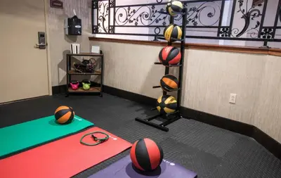 a gym with basketballs and balls on the floor at Empeiria High Sierra Hotel in Mammoth Lakes
