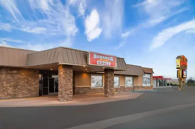 a building with a sign for a burger king at Super 8 by Wyndham Fallon in Fallon