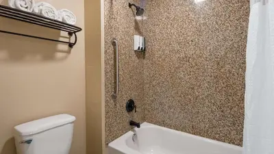 a bathroom with a shower with a toilet and a sink at Best Western Apricot Inn in Chaney Ranch