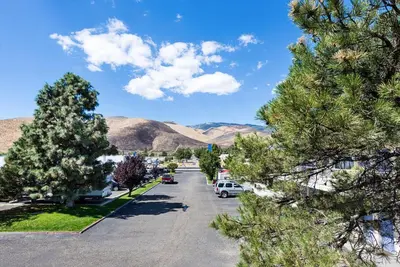 a street in a town with mountains in the background at Motel 6-Carson City, NV in Carson City
