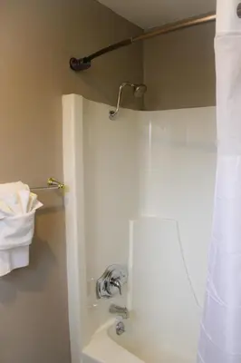 a bathroom with a sink and a shower with a mirror at The Alder Inn in South Lake Tahoe