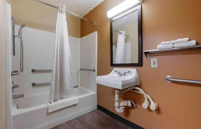 a bathroom with a sink and a shower and a tub at Extended Stay America Suites - Sacramento - Elk Grove in Elk Grove