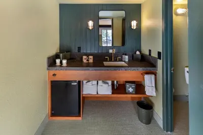 a bathroom with a sink and a mirror at Station House Inn South Lake Tahoe in South Lake Tahoe