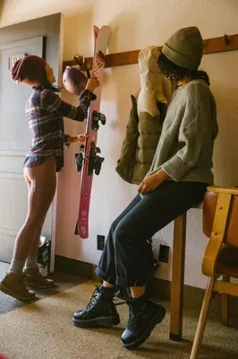 a young girl standing next to a woman in a room at Station House Inn South Lake Tahoe in South Lake Tahoe