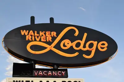 a sign for a w walker riverride on a building at Walker River Lodge in Bridgeport
