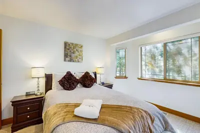 a bedroom with a bed with two pillows on it at Montgomery Estates Retreat in South Lake Tahoe