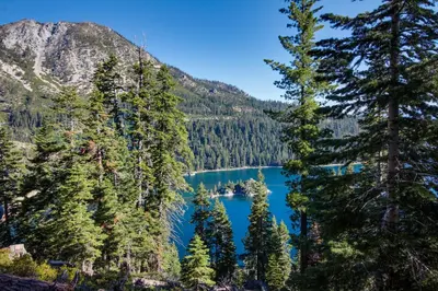 a view of crater lake through the trees at Montgomery Estates Retreat in South Lake Tahoe
