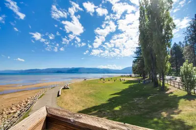 a group of people on a beach near the water at Montgomery Estates Retreat in South Lake Tahoe