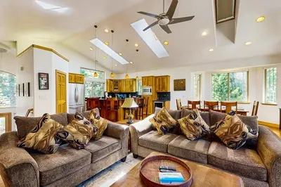 a living room with two couches and a table at Montgomery Estates Retreat in South Lake Tahoe