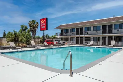 a swimming pool in front of a hotel at Econo Lodge Stockton near I-5 Fairgrounds in Stockton