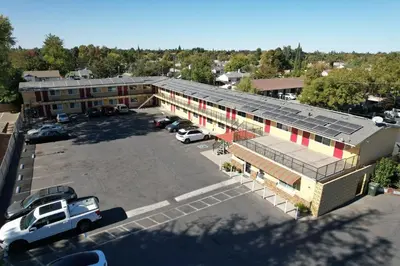 an overhead view of a building with a parking lot at Sky Riders Motel in Sacramento