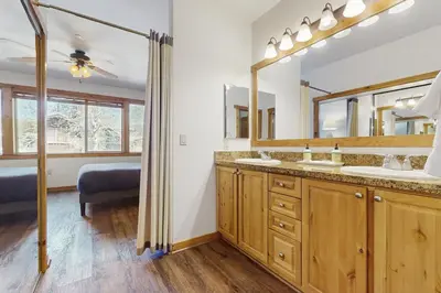 a bathroom with two sinks and a mirror at Dolomite Delight in Truckee