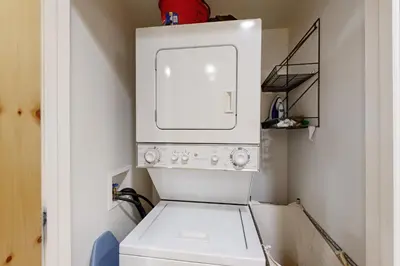 a white washer and dryer in a bathroom at Tavern Inn #55 in Olympic Valley