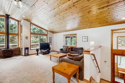 a living room with a couch and a table at Inviting, Comfortable Mountain Home in Truckee