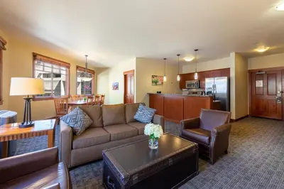 a living room with a couch and a table at The Village at Palisades Tahoe in Olympic Valley