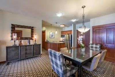 a kitchen and dining room with a table and chairs at The Village at Palisades Tahoe in Olympic Valley