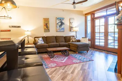 a living room with a couch and a table at The Village at Palisades Tahoe in Olympic Valley