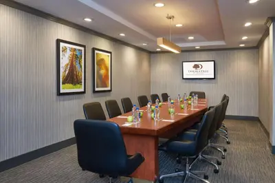 a conference room with a long table and chairs at DoubleTree by Hilton Fresno Convention Center in Fresno