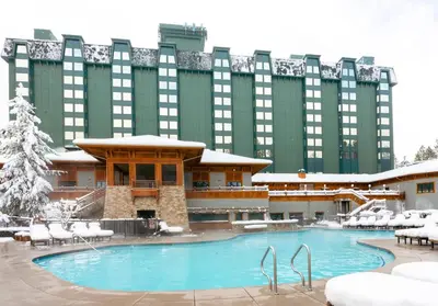 a hotel with a swimming pool in front of a building at Hyatt Regency Lake Tahoe Resort, Spa & Casino in Incline Village
