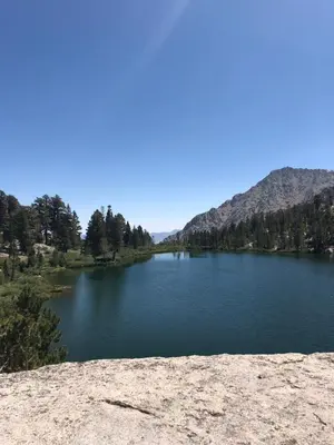 a view of a lake with mountains in the background at Winnedumah Hotel in Independence