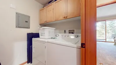 a kitchen with a washing machine and a sink at Snowcreek V #997 Condo in Mammoth Lakes